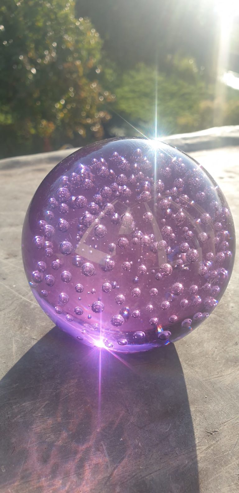 An image of a purple sparkling ball